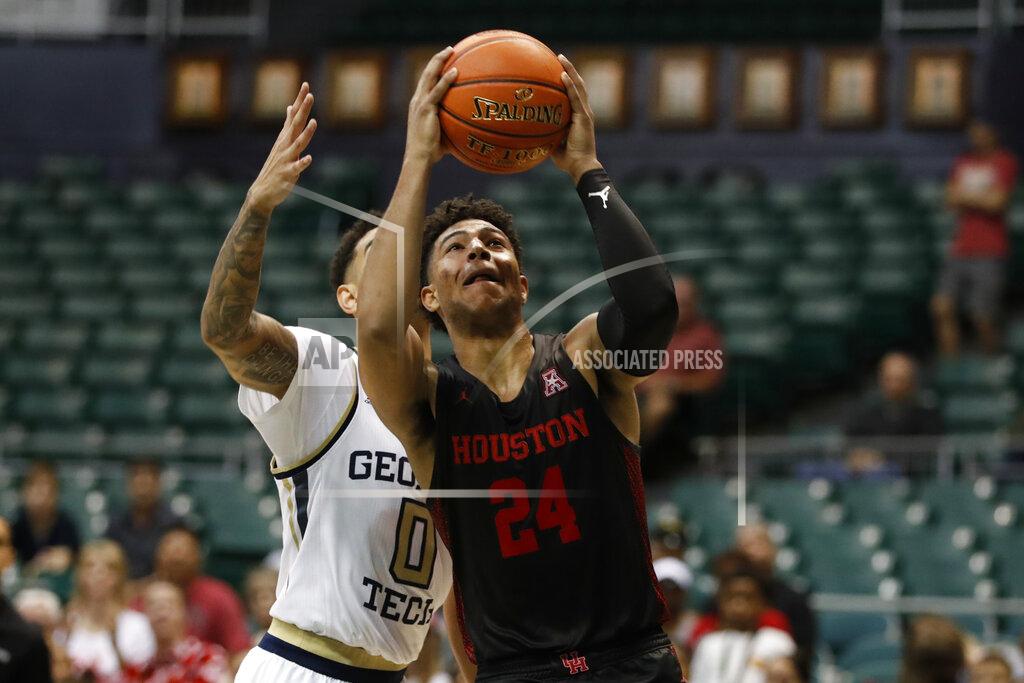 Marco Garcia Houston guard Quentin Grimes goes to the basket, in front of Georgia Tech guard Michael Devoe (0) during the second half of an NCAA college basketball game Monday, Dec. 23, 2019, in Honolulu. (AP Photo/Marco Garcia)