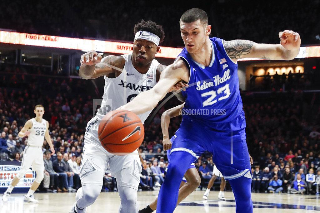 John Minchillo Seton Hall forward Sandro Mamukelashvili (23) and Xavier forward Tyrique Jones (0) chase a rebound during the first half of an NCAA college basketball game Wednesday, Jan. 2, 2019, in Cincinnati. (AP Photo/John Minchillo)