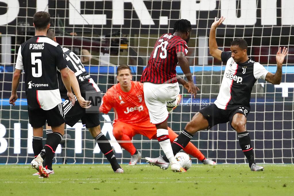 Antonio Calanni AC Milan's Franck Kessie, center, scores against Juventus during the Serie A soccer match between AC Milan and Juventus at the San Siro stadium, in Milan, Italy, Tuesday, July 7, 2020. (AP Photo/Antonio Calanni)