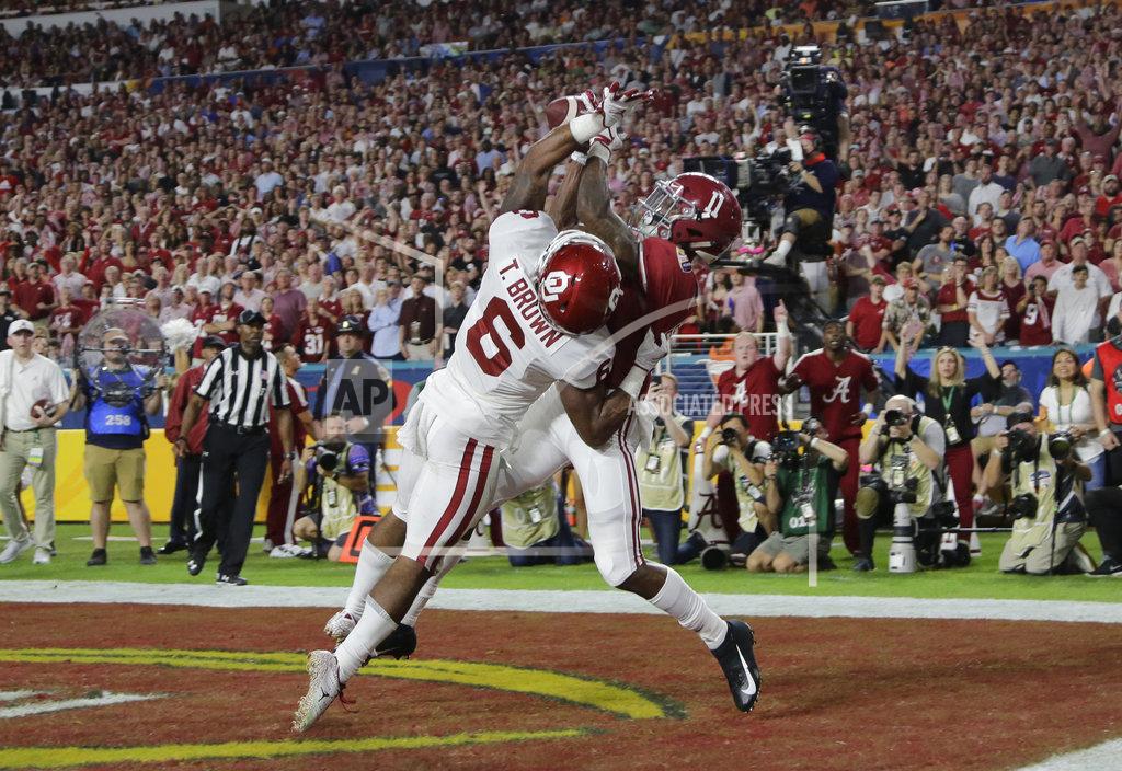 Lynne Sladky Alabama wide receiver Henry Ruggs III (11) catches a pass in the end zone for touchdown as Oklahoma cornerback Tre Brown (6) defends, during the first half of the Orange Bowl NCAA college football game, Saturday, Dec. 29, 2018, in Miami Gardens, Fla. (AP Photo/Lynne Sladky)