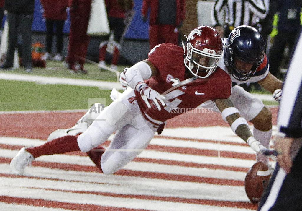 Young Kwak Washington State cornerback Marcus Strong (4) and Arizona wide receiver Shawn Poindexter go after an Arizona fumble, which Strong recovered during the first half of an NCAA college football game in Pullman, Wash., Saturday, Nov. 17, 2018. (AP Photo/Young Kwak)
