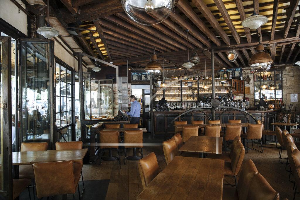 Lewis Joly Inside Le Jaures restaurant a day prior the nationwide reopening of the restaurants interior, in Paris, France, Tuesday, June 8, 2021. (AP Photo/Lewis Joly)