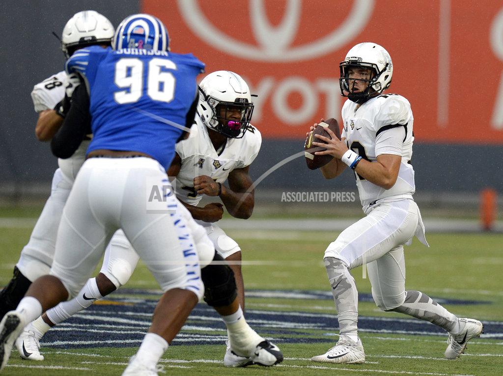 Mark Zaleski Central Florida quarterback McKenzie Milton, right, passes against Memphis during the second half of an NCAA college football game Saturday, Oct. 13, 2018, in Memphis, Tenn. Central Florida won 31-30. (AP Photo/Mark Zaleski)
