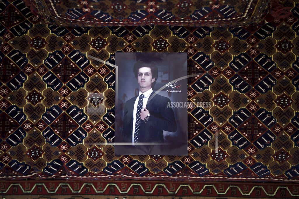 Felipe Dana A portrait of Zaki Anwari, a 17-year-old soccer player who died after falling from a departing U.S. Air Force C-17 on Aug. 16, hangs in his family house in Kabul, Afghanistan, Friday, Sept. 17, 2021. (AP Photo/Felipe Dana)