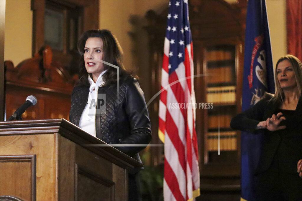 Uncredited In a photo provided by the Michigan Office of the Governor, Michigan Gov. Gretchen Whitmer addresses the state during a speech in Lansing, Mich., Thursday, Oct. 8, 2020. The governor delivered remarks addressing Michiganders after the Michigan Attorney General, Michigan State Police, U.S. Department of Justice, and FBI announced state and federal charges against 13 members of two militia groups who were preparing to kidnap and possibly kill the governor. (Michigan Office of the Governor via AP)