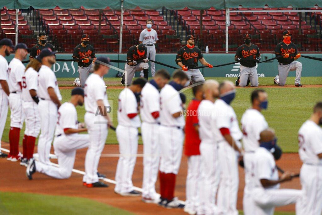 Michael Dwyer The Boston Red Sox and the Baltimore Orioles line up on the base lines during a tribute to the Black Lives Matter movement before an opening day baseball game at Fenway Park, Friday, July 24, 2020, in Boston. (AP Photo/Michael Dwyer)
