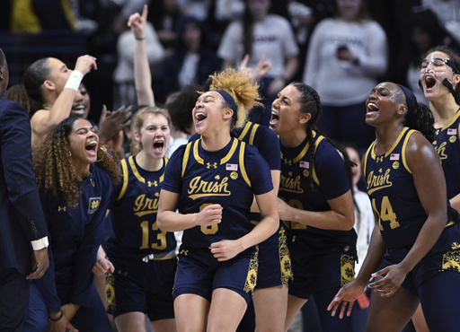 Notre Dame guard Hannah Hidalgo (3) and teammates celebrate a win over UConn in an NCAA college basketball game Saturday, Jan. 27, 2024, in Storrs, Conn. (Cloe Poisson/Hartford Courant via AP)