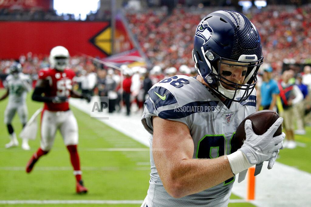 Ross D. Franklin Seattle Seahawks tight end Will Dissly (88) pulls in a touchdown pass against the Arizona Cardinals during the first half of an NFL football game, Sunday, Sept. 29, 2019, in Glendale, Ariz. (AP Photo/Ross D. Franklin)