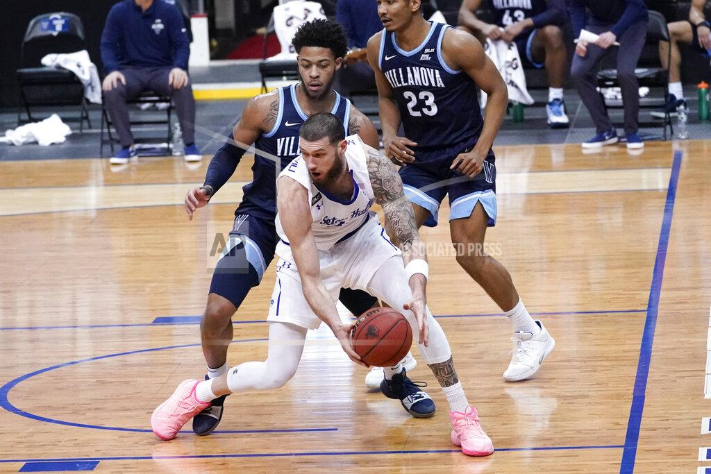 Mary Altaffer Seton Hall forward Sandro Mamukelashvili, foreground, drives against Villanova guard Justin Moore during the first half of an NCAA college basketball game, Saturday, Jan. 30, 2021, in Newark, N.J. (AP Photo/Mary Altaffer)