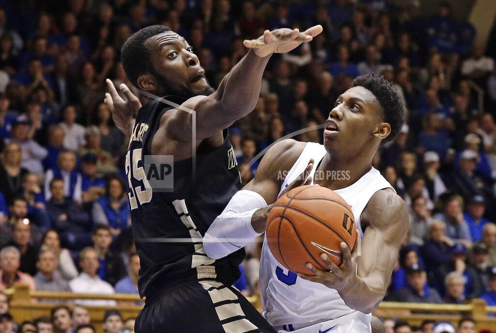 Gerry Broome Duke's RJ Barrett (5) drives to the basket against Wake Forest's Ikenna Smart (35) during the second half of an NCAA college basketball game in Durham, N.C., Tuesday, March 5, 2019. Duke won 71-70. (AP Photo/Gerry Broome)