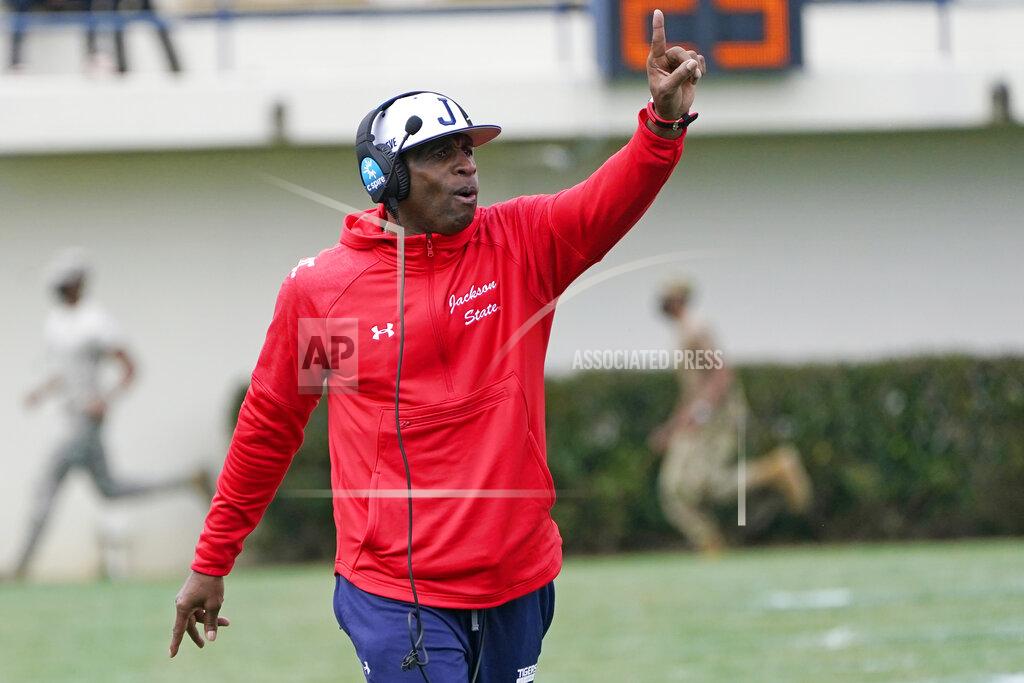 Rogelio V. Solis Jackson State football coach Deion Sanders calls out to his players during the first half of an NCAA college football against Edward Waters in Jackson, Miss., Sunday, Feb. 21, 2021. The game marks Sanders's collegiate head coaching debut. (AP Photo/Rogelio V. Solis)