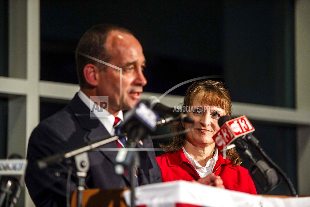Kendall Warner Bob Good's wife, Tracey, watches as he speaks to friends, family and supporters in Lynchburg, Va., Tuesday, Nov. 3, 2020. Good is running for the seat in the state's 5th Congressional District. (Kendall Warner/The News & Advance via AP)