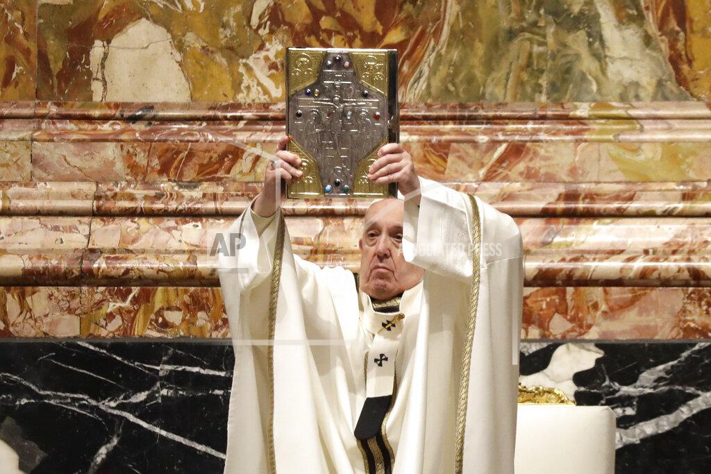 Andrew Medichini Pope Francis holds up the book of Gospels during a Chrism Mass inside St. Peter's Basilica, at the Vatican, Thursday, April 1, 2021. During the Mass the Pontiff blesses a token amount of oil that will be used to administer the sacraments for the year. (AP Photo/Andrew Medichini, pool)