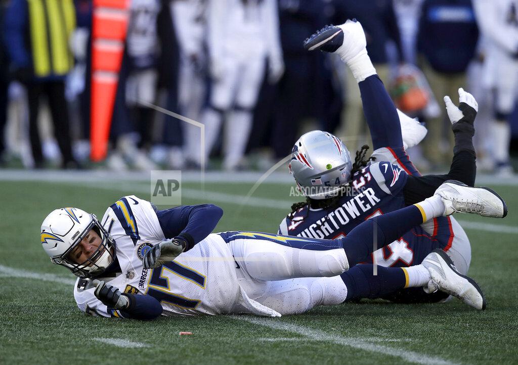 Charles Krupa Los Angeles Chargers quarterback Philip Rivers (17) hits the turf after being knocked down by New England Patriots linebacker Dont'a Hightower (54) during the first half of an NFL divisional playoff football game, Sunday, Jan. 13, 2019, in Foxborough, Mass. (AP Photo/Charles Krupa)