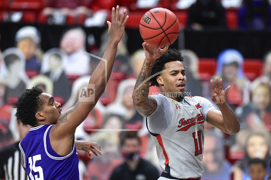 Justin Rex Texas Tech's Kyler Edwards (11) passes the ball during the first half of the team's NCAA college basketball game against TCU in Lubbock, Texas, Tuesday, March 2, 2021. (AP Photo/Justin Rex)