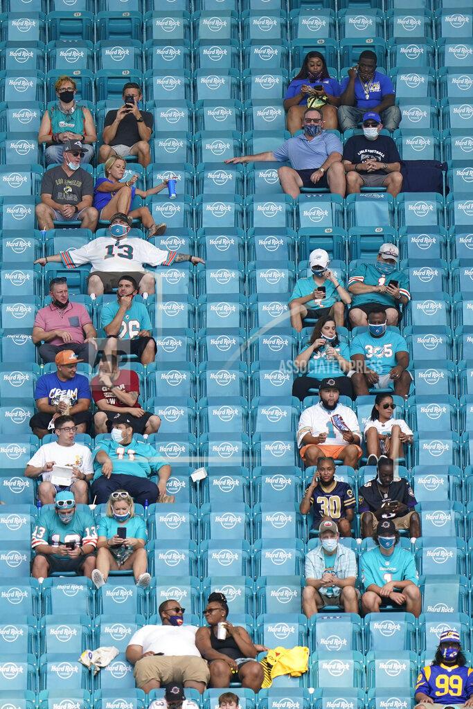 Wilfredo Lee Fans watch during the first half of an NFL football game between the Miami Dolphins and the Los Angeles Rams, Sunday, Nov. 1, 2020, in Miami Gardens, Fla. (AP Photo/Wilfredo Lee)