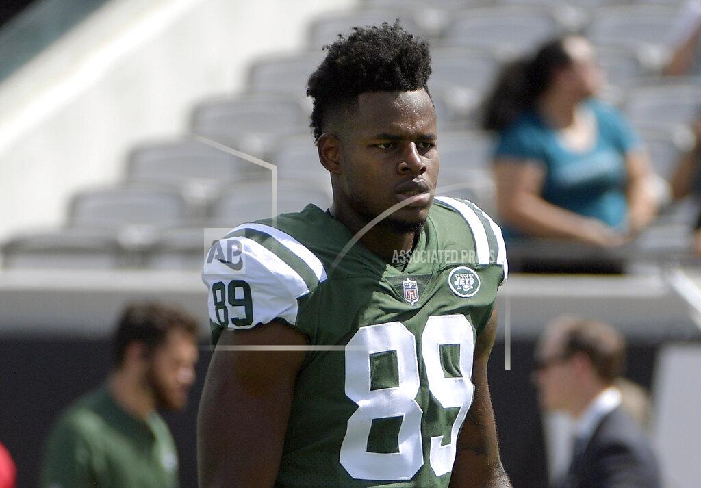 FILE - In this Sept.30, 2018, file photo, New York Jets tight end Chris Herndon warms up before an NFL football game against the Jacksonville Jaguars in Jacksonville, Fla. Herndon has been suspended without pay by the NFL for the first four regular-season games for violating the league's substance abuse policy. Herndon pleaded guilty in January to driving while intoxicated in New Jersey in June 2018. (AP Photo/Phelan M. Ebenhack, File)