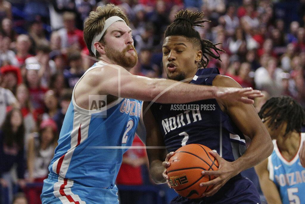 Young Kwak Gonzaga forward Drew Timme, left, fouls North Florida guard Chaz Lanier during the second half of an NCAA college basketball game, Monday, Nov. 7, 2022, in Spokane, Wash. Gonzaga won 104-63. (AP Photo/Young Kwak)