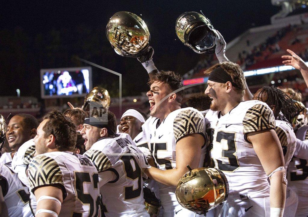 Ben Mckeown Wake Forest players celebrate after defeating North Carolina State in an NCAA college football game in Raleigh, N.C., Thursday, Nov. 8, 2018. (AP Photo/Ben McKeown)