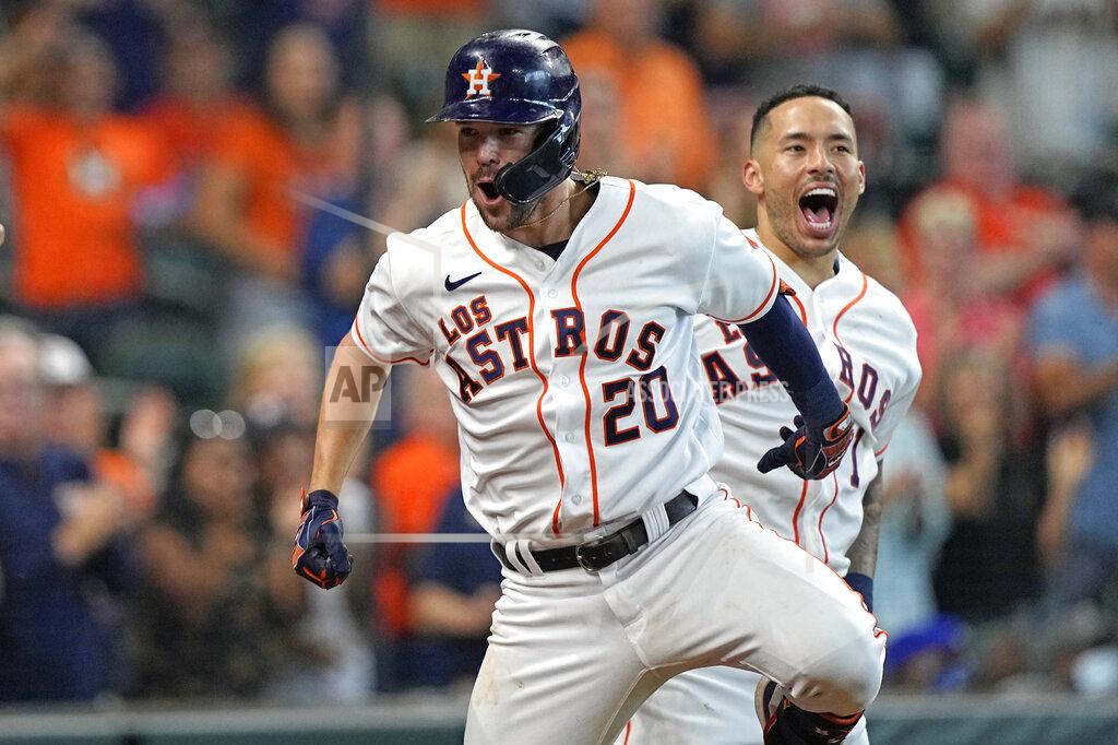David J. Phillip Houston Astros' Chas McCormick (20) celebrates with Carlos Correa (1) after hitting a home run against the Arizona Diamondbacks during the eighth inning of a baseball game Sunday, Sept. 19, 2021, in Houston. (AP Photo/David J. Phillip)