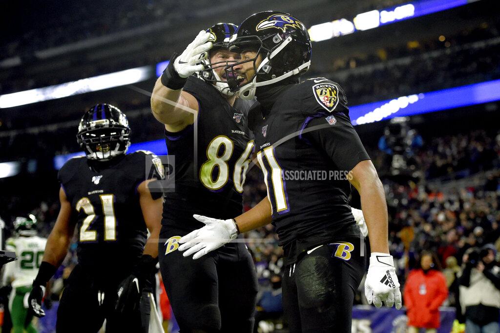 Gail Burton Baltimore Ravens wide receiver Seth Roberts (11) celebrates his touchdown catch with tight end Nick Boyle (86) and running back Mark Ingram (21) during the second half of an NFL football game against the New York Jets, Thursday, Dec. 12, 2019, in Baltimore. (AP Photo/Gail Burton)