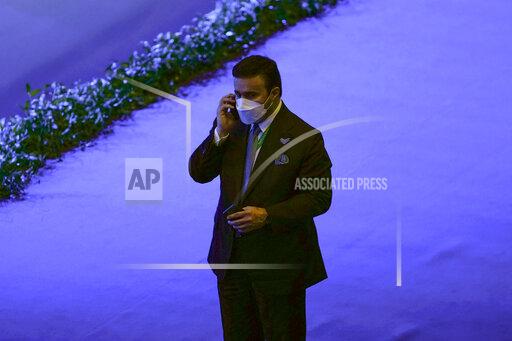Inspector general at the United Arab Emirates interior ministry Maj. Gen. Ahmed Naser al-Raisi speaks on his cell phone during the first day of the Interpol annual assembly in Istanbul, Turkey, Tuesday, Nov. 23, 2021. Interpol is holding its General Assembly in Istanbul to discuss security threats and to hold a closely watched election for the international policing body's new leadership. (AP Photo/Francisco Seco)