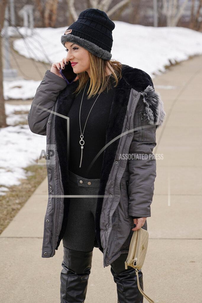 Keith Srakocic In this Monday, Feb. 8, 2021, photo, Allissa Star talks on her phone as she walks near the north shore of the Allegheny River in Pittsburgh. Starr worked about a week every month at a brothel in Pahrump, Nev., outside of Las Vegas. Then the pandemic led to the shuttering of Nevada's licensed bordellos, the only place where prostitution is legal in the state, and they have remained closed since March, leaving sex workers like Starr struggling to pay the bills and turning to alternatives like "virtual" dates. (AP Photo/Keith Srakocic)