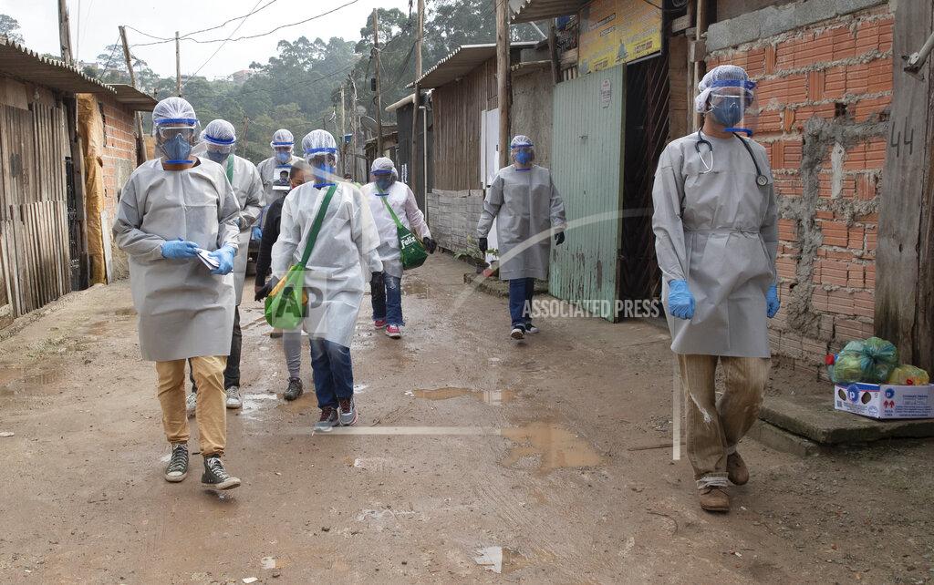 Andre Penner Health workers from Doctors Without Borders visit a squatters camp to conduct medical examinations and avoid the spread of the COVID-19 in Sao Bernardo do Campo, greater Sao Paulo area, Brazil, Wednesday, June 3, 2020. (AP Photo/Andre Penner)