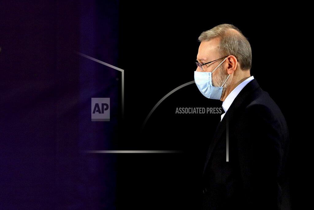 Ebrahim Noroozi Former Iranian parliament speaker Ali Larijani attends a news conference after registering his candidacy for the June 18 presidential elections at the elections headquarters of the Interior Ministry in Tehran, Iran, Saturday, May 15, 2021. (AP Photo/Ebrahim Noroozi)