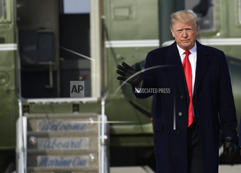 Susan Walsh President Donald Trump waves as he walks from Marine One to Air Force One at Andrews Air Force Base in Md., Saturday, Dec. 8, 2018. Trump is heading to the Army-Navy football game in Philadelphia. (AP Photo/Susan Walsh)