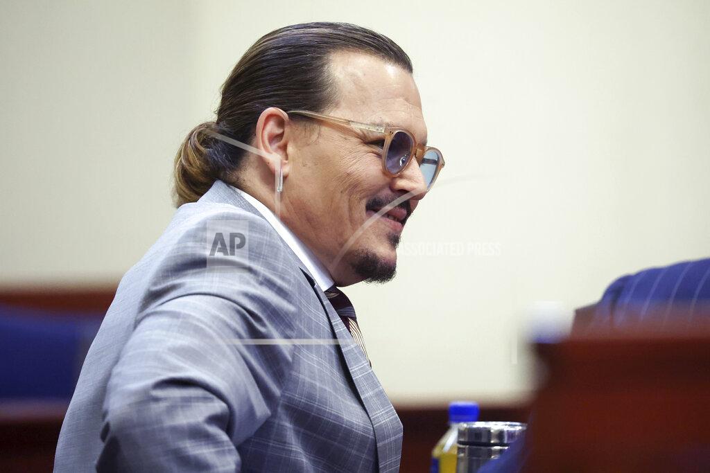 Michael Reynolds Actor Johnny Depp arrives in the courtroom in the Fairfax County Circuit Courthouse in Fairfax, Va., Thursday, May 26, 2022. Actor Johnny Depp sued his ex-wife Amber Heard for libel in Fairfax County Circuit Court after she wrote an op-ed piece in The Washington Post in 2018 referring to herself as a "public figure representing domestic abuse." (Michael Reynolds/Pool Photo via AP)