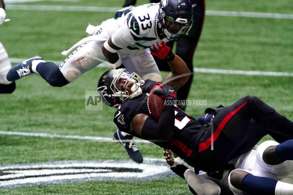 John Bazemore Atlanta Falcons running back Todd Gurley (21) is stopped by Seattle Seahawks strong safety Jamal Adams (33) during the first half of an NFL football game, Sunday, Sept. 13, 2020, in Atlanta. (AP Photo/John Bazemore)