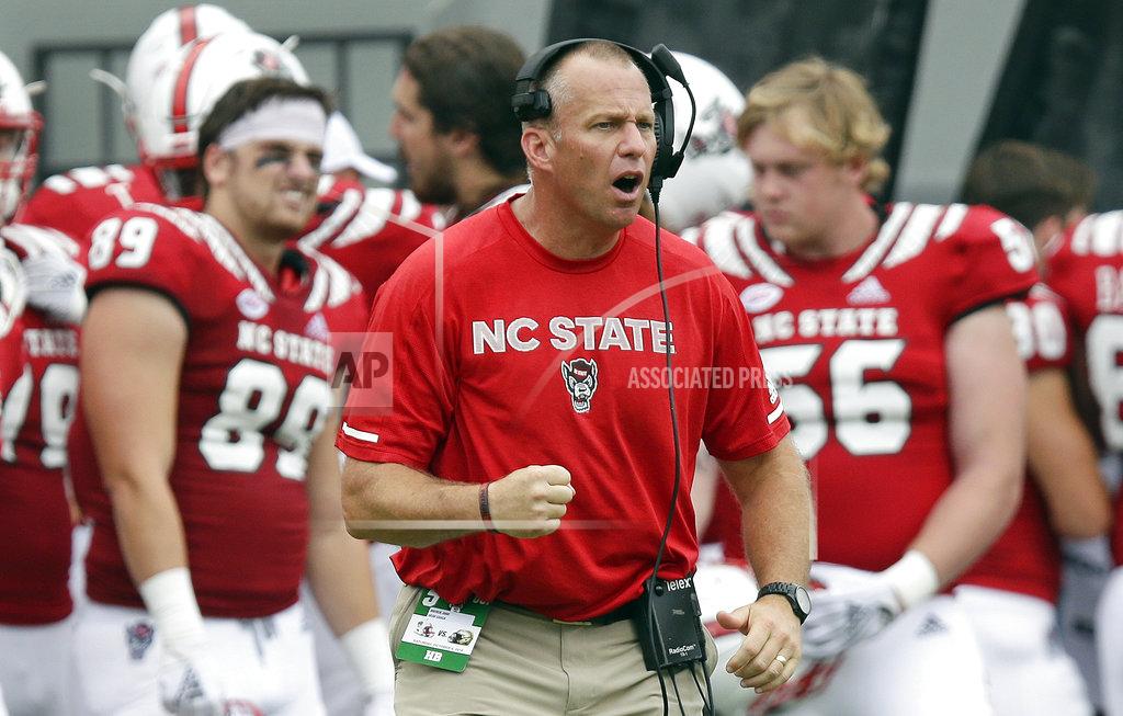 Gerry Broome FILE - In this Oct. 6, 2018, file photo, North Carolina State head coach Dave Doeren reacts during the second half an NCAA college football game against Boston College, in Raleigh, N.C. The Wolfpack are coming off consecutive losses to Clemson and Syracuse entering Saturday's game against Florida State. (AP Photo/Gerry Broome, File)