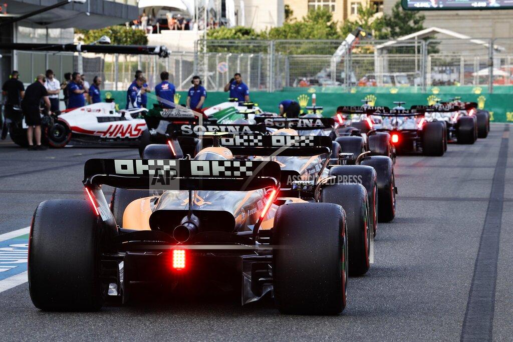 Hamad Mohammed Cars line up at pits during the qualifying session at the Baku circuit, in Baku, Azerbaijan, Saturday, June 11, 2022. The Formula One Grand Prix will be held on Sunday. (Hamad Mohammed, Pool Via AP)