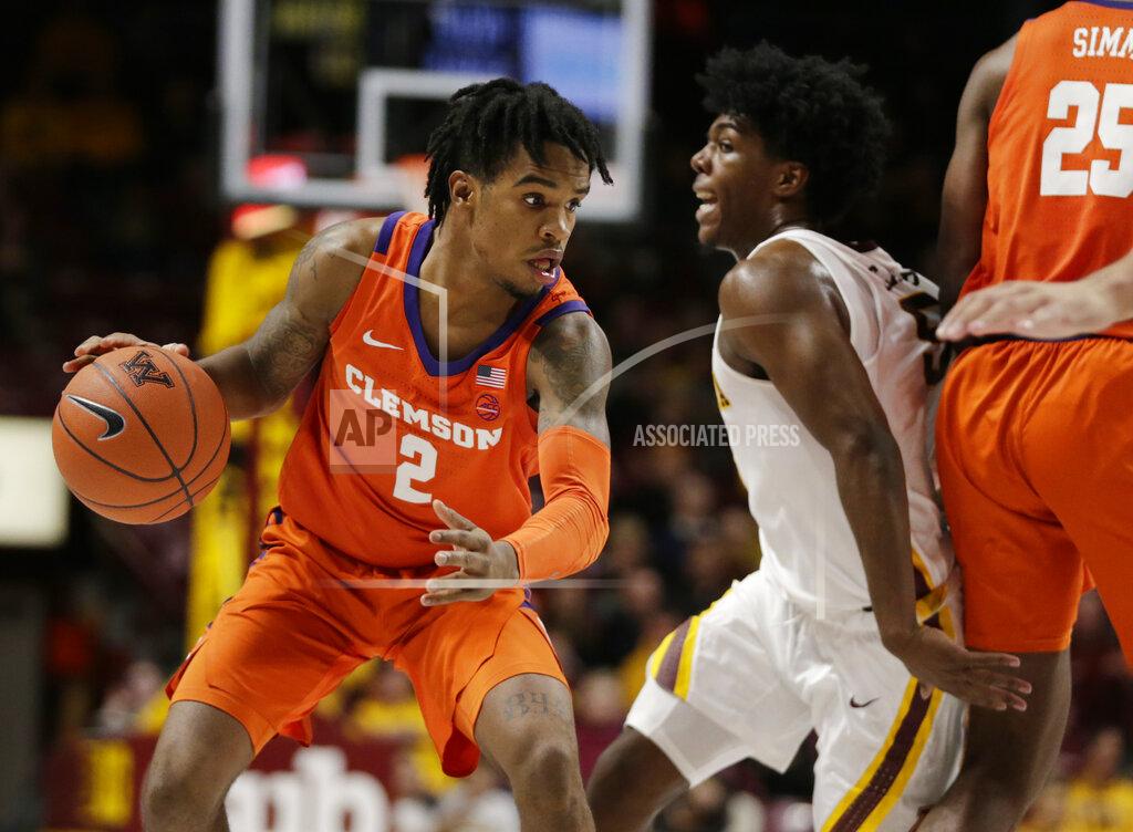 Andy Clayton-King Clemson guard Al-Amir Dawes (2) drives against Minnesota guard Marcus Carr (5) in the second half during an NCAA college basketball game Monday, Dec. 2, 2019, in Minneapolis. (AP Photo/Andy Clayton-King)