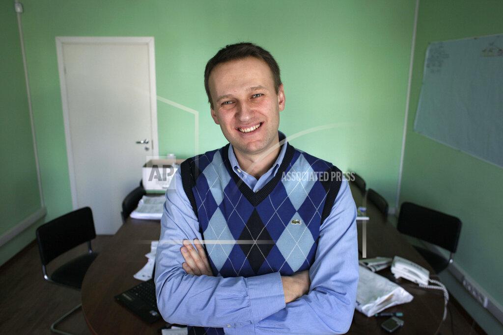 Alexander Zemlianichenko FILE - In this March 17, 2010, file photo, corporate Russian lawyer Alexei Navalny poses in his office in Moscow, Russia. Navalny is an anti-corruption campaigner and the Kremlin’s fiercest critic. He has outlasted many opposition figures and is undeterred by incessant attempts to stop his work. (AP Photo/Alexander Zemlianichenko, File)