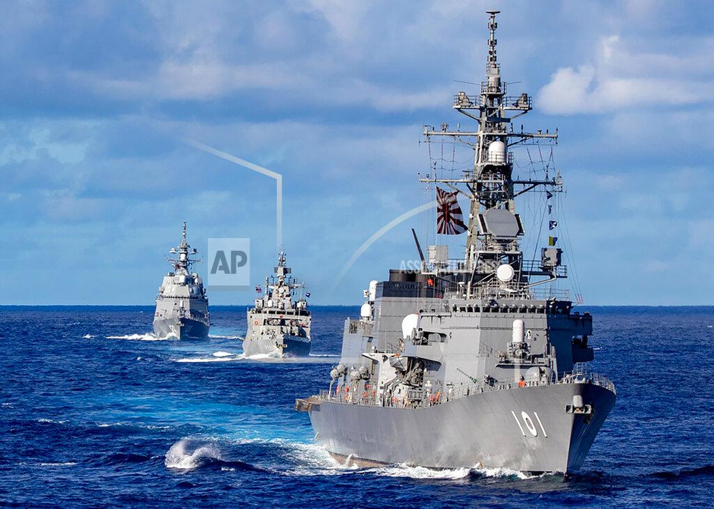 Mass Communication Specialist 3Rd Class Justin Stack In this photo released by Defense Visual Information Distribution Service, ships from Japan Maritime Self-Defense Force and Indian Navy sail in formation with Royal Australian Navy HMAS Warramunga and Arleigh Burke-class guided-missile destroyer USS Barry (DDG 52) during MALABAR 2021 on Aug. 27, 2021. China seeks to bring the strategically and symbolically important island back under its control, and the U.S. sees Taiwan in the context of broader challenges from China. (Justin Stack/DVIDS U.S. Navy via AP)