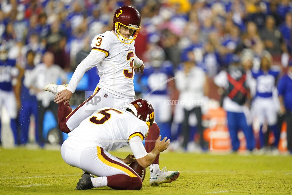 Patrick Semansky Washington Football Team punter Tress Way (5) holds the ball as kicker Dustin Hopkins (3) hits the winning field goal against the New York Giants in the second half of an NFL football game, Thursday, Sept. 16, 2021, in Landover, Md. Washington won 30 - 29. (AP Photo/Patrick Semansky)