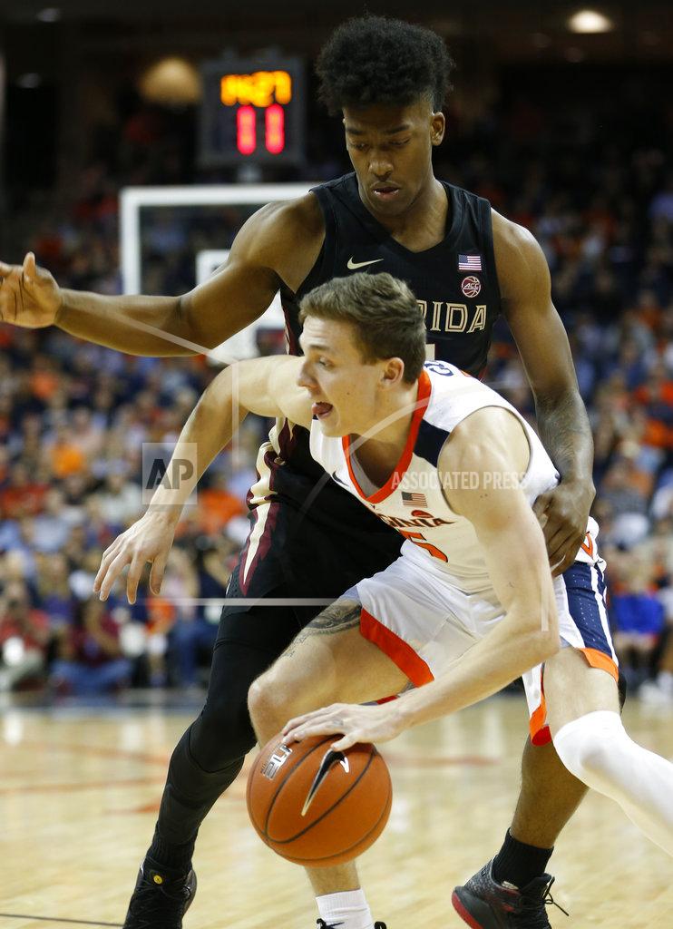Steve Helber Virginia guard Kyle Guy (5) drives past Florida State guard Florida State guard Terance Mann (14) during the first half of an NCAA college basketball game in Charlottesville, Va., Saturday, Jan. 5, 2019. (AP Photo/Steve Helber)