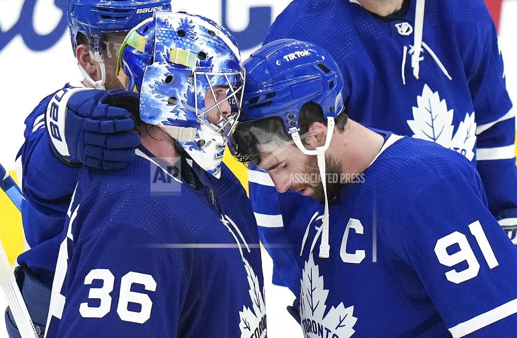 Nathan Denette Toronto Maple Leafs forward John Tavares (91) reacts with goaltender Jack Campbell (36) after being knocked out of the Stanley Cup playoffs in Game 7 of an NHL hockey first-round playoff series against the Tampa Bay Lightning in Toronto, Saturday, May 14, 2022. (Nathan Denette/The Canadian Press via AP)