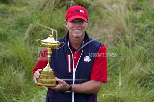 Team USA captain Steve Stricker poses with the trophy after the Ryder Cup matches at the Whistling Straits Golf Course Sunday, Sept. 26, 2021, in Sheboygan, Wis. (AP Photo/Ashley Landis)