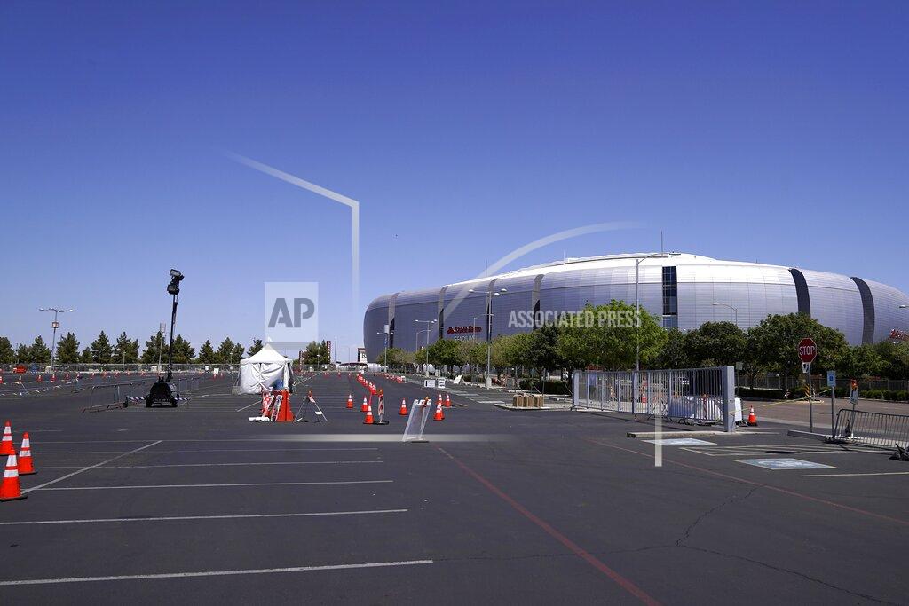 Ross D. Franklin A once bustling Arizona state-run COVID-19 mass-vaccination site at State Farm Stadium closed Friday, April 23, 2021, in Glendale, Ariz. Arizona continues to transition outdoor operations to indoor venues. (AP Photo/Ross D. Franklin)