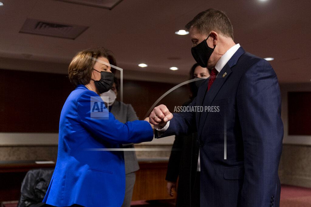 Andrew Harnik Chairwoman Sen. Amy Klobuchar, D-Minn., left, speaks with former U.S. Capitol Police Chief Steven Sund, right, following a Senate Homeland Security and Governmental Affairs & Senate Rules and Administration joint hearing on Capitol Hill, Washington, Tuesday, Feb. 23, 2021, to examine the January 6th attack on the Capitol. (AP Photo/Andrew Harnik, Pool)