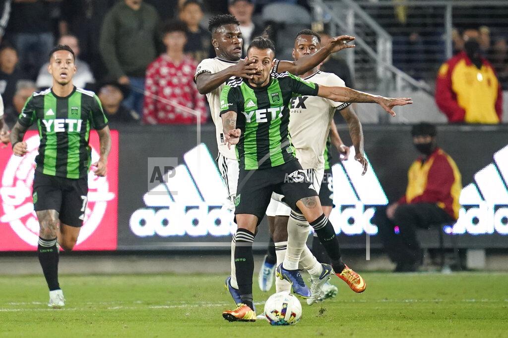 Ashley Landis Los Angeles FC midfielder José Cifuentes (11) puts his hand in the face of Austin FC forward Maximiliano Urruti (37) during the first half of an MLS soccer match in Los Angeles, Wednesday, May 18, 2022. (AP Photo/Ashley Landis)