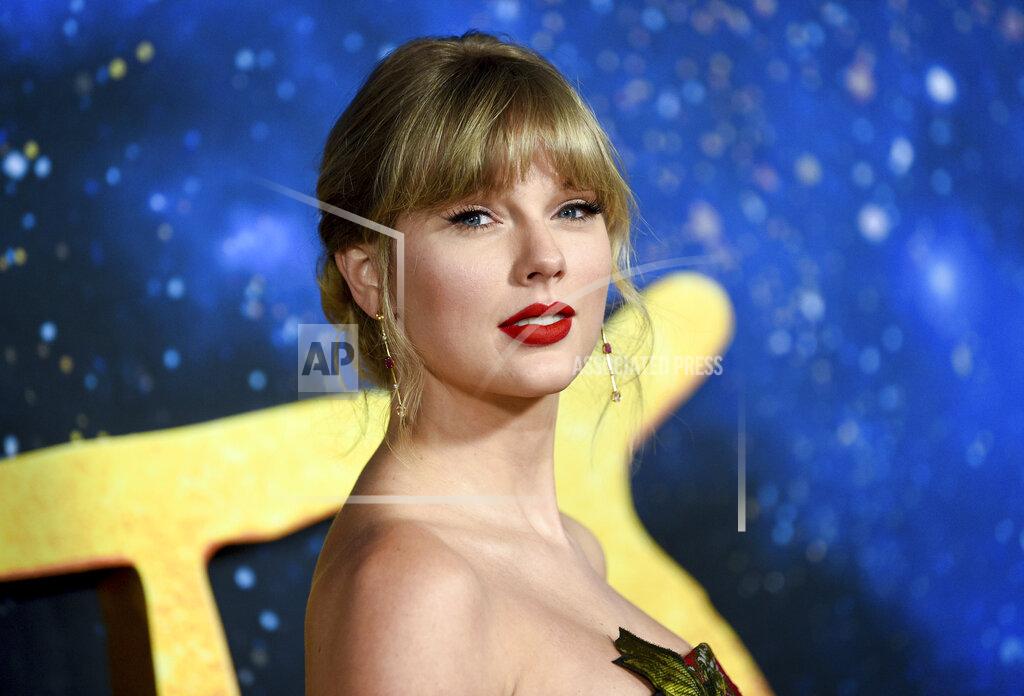 Evan Agostini FILE - Singer-actress Taylor Swift attends the world premiere of "Cats" in New York on Dec. 16, 2019. Swift has a new album coming out on Friday called "Folklore." She says the standard edition will include 16 tracks and the album will feature Bon Iver, Aaron Dessner of The National and frequent collaborator Jack Antonoff. (Photo by Evan Agostini/Invision/AP, File)