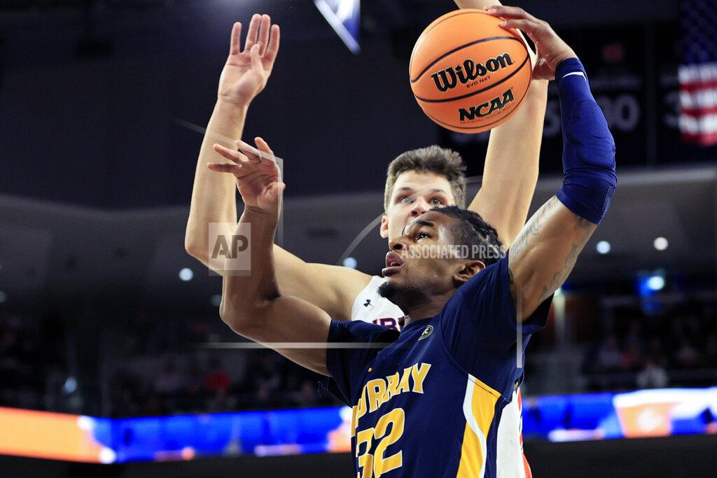 Butch Dill Murray State forward Nicholas McMullen (32) goes up for the shot as Auburn forward Walker Kessler (13) defends during the first half of an NCAA college basketball game Wednesday, Dec. 22, 2021, in Auburn, Ala. (AP Photo/Butch Dill)