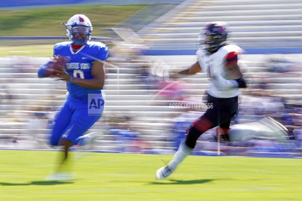 Tennessee State quarterback Deveon Bryant, left, scrambles from Southeast Missouri State linebacker Omardrick Douglas during an NCAA college football game Sunday, April 11, 2021, in Nashville, Tenn. Because of COVID-19, the OVC postponed the 2020 season to the spring, and the decision was made to play games on Sunday because member schools needed flexibility to staff all the spring sports. (AP Photo/Mark Humphrey)