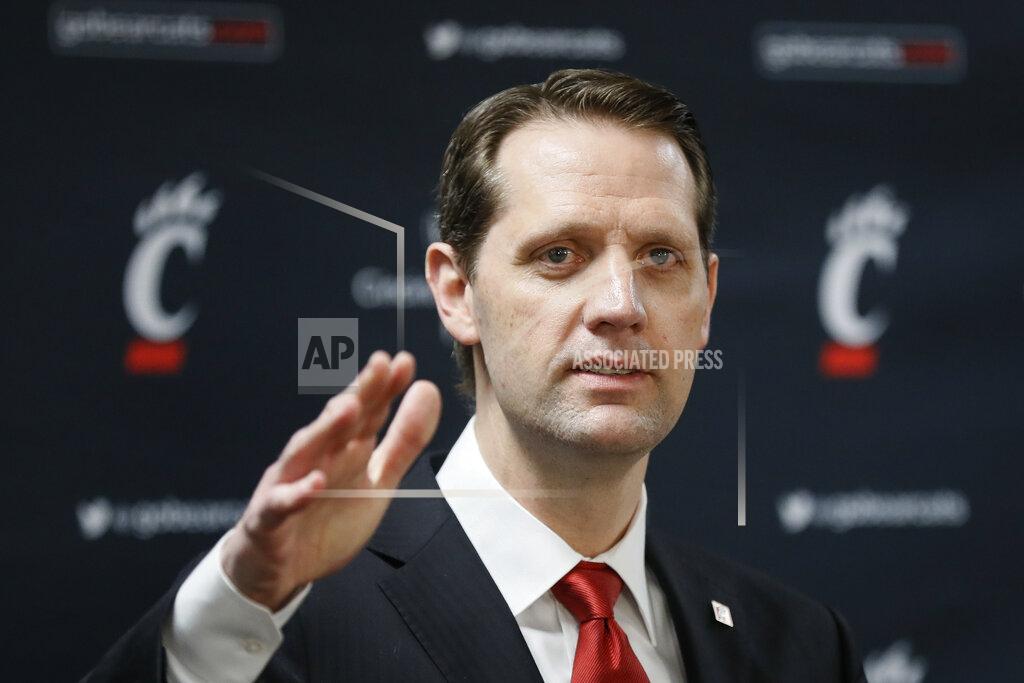 John Minchillo FILE - This April 15, 2019, file photo shows John Brannen speaking during a news conference to formally announce his hiring as Cincinnati's men's basketball coach in Cincinnati. Mick Cronin left for UCLA, and Cincinnati turned to a familiar local coach, Brannen, as his replacement. The Bearcats are undergoing significant changes in his first season. (AP Photo/John Minchillo, File)