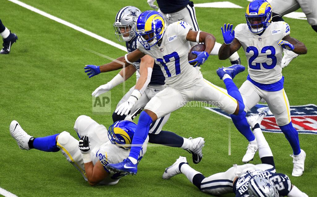Wide receiver Robert Woods (17) of the Los Angeles Rams leaps for the first down against the Dallas Cowboys in the first half of a NFL football game on opening night at SoFi Stadium in Inglewood on Sunday, September 13, 2020. (Keith Birmingham/The Orange County Register via AP)