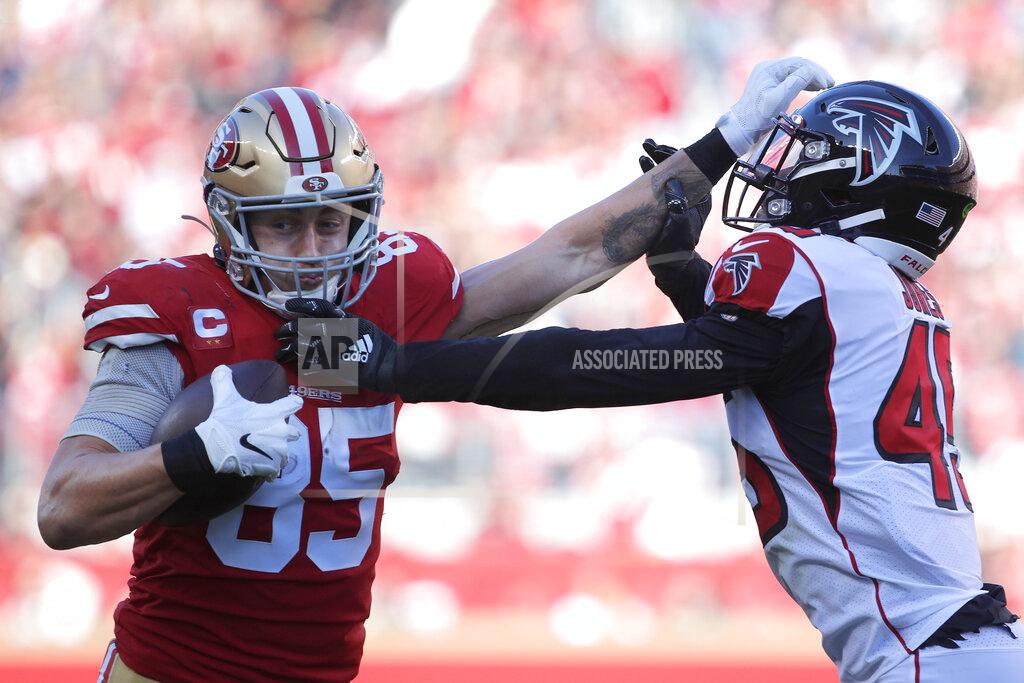 San Francisco 49ers tight end George Kittle (85) stiff arms Atlanta Falcons linebacker Deion Jones during the first half of an NFL football game in Santa Clara, Calif., Sunday, Dec. 15, 2019. (AP Photo/Josie Lepe)